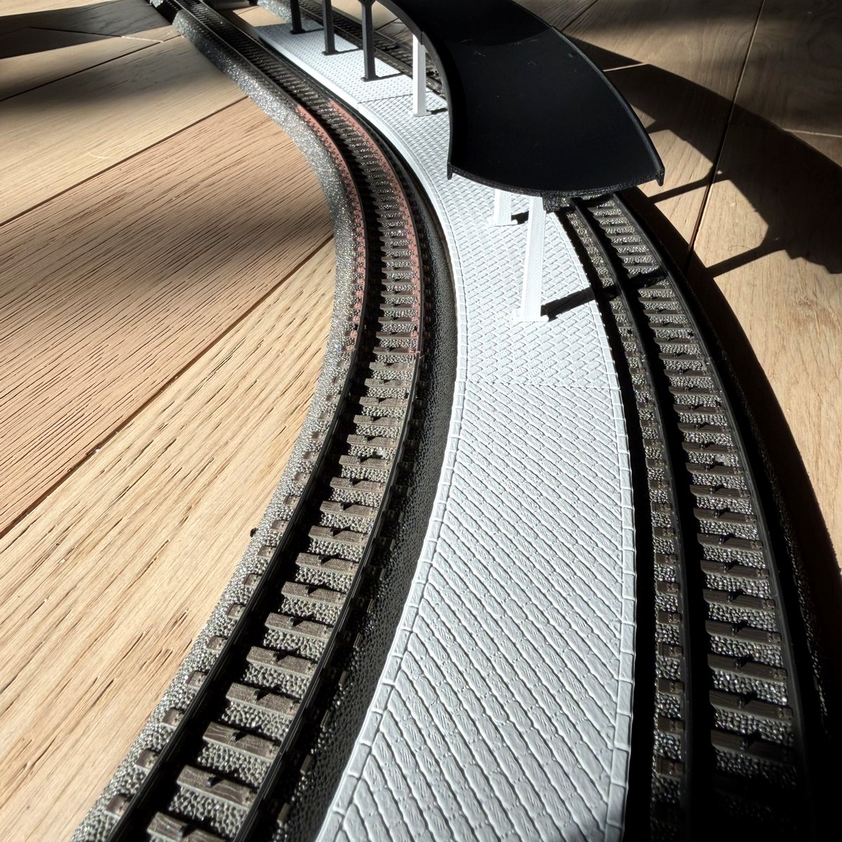 Real print: curved station canopy in low sunlight